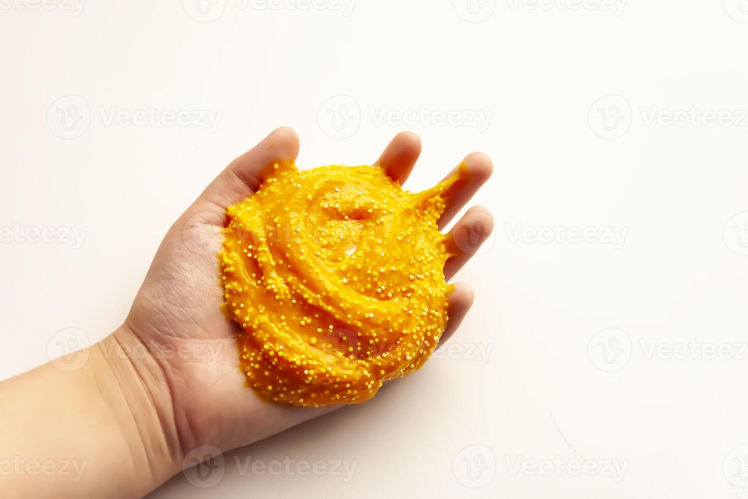 The child plays with slime elastic mass photo