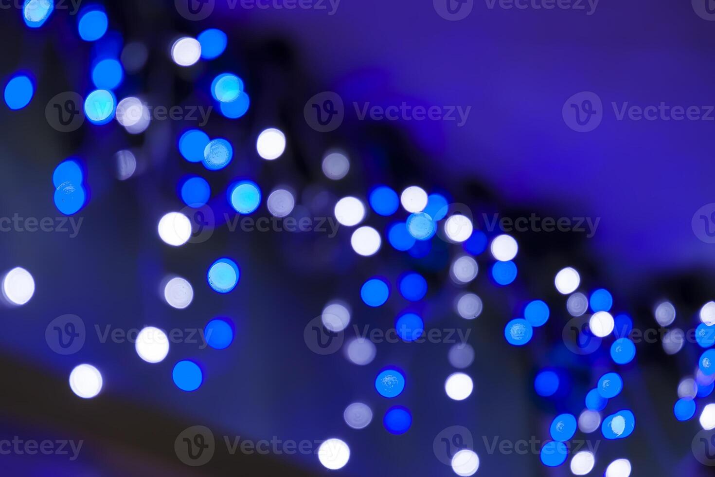 Colorful bokeh garland lights festive background. photo