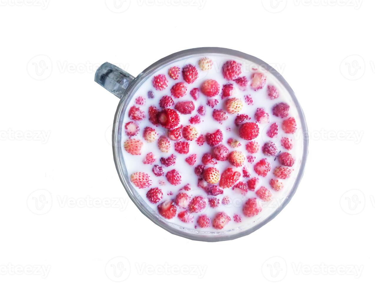 Fresh strawberries with milk in a cup photo