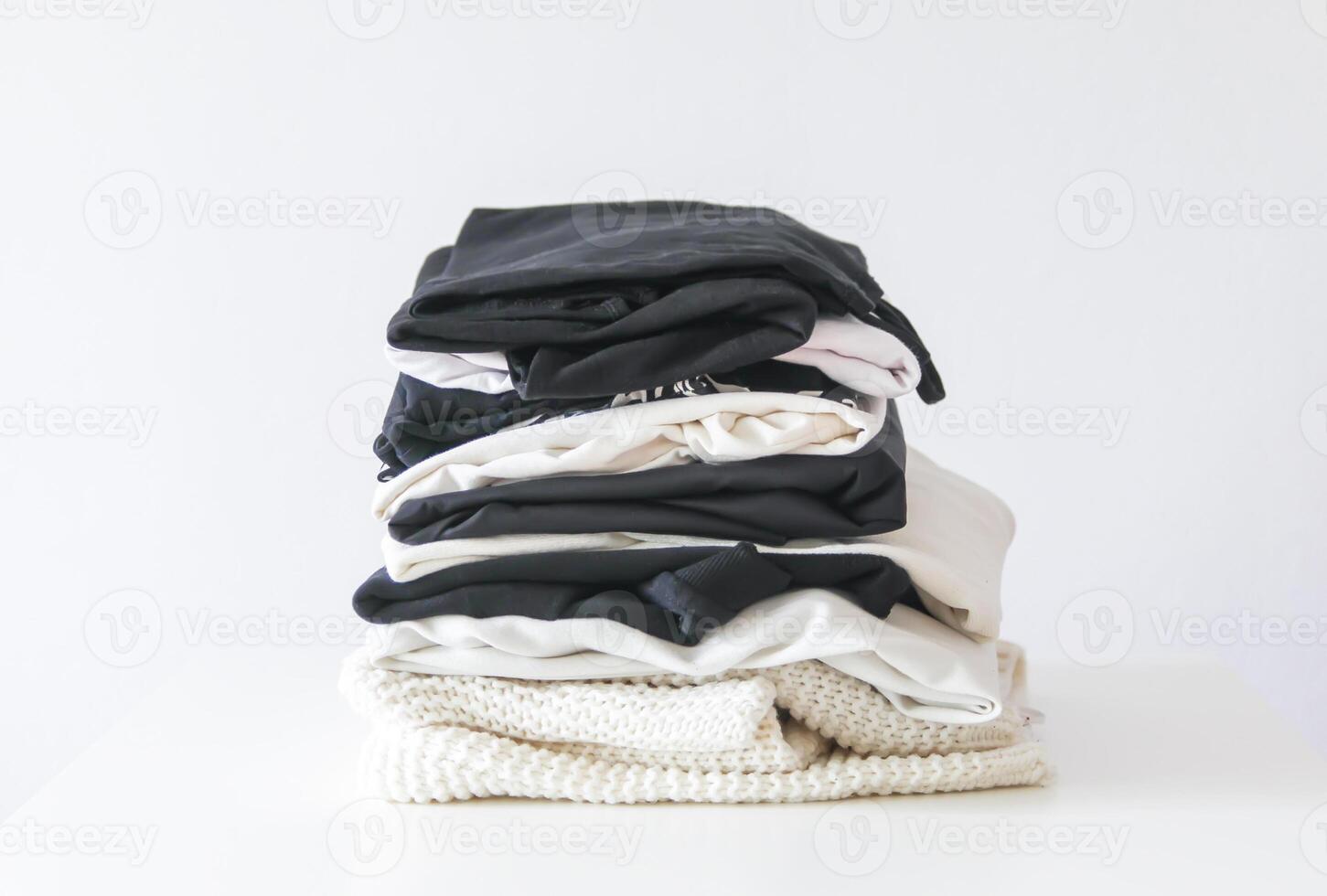 Stack of folded colorful clothes. Compact storage organizing photo
