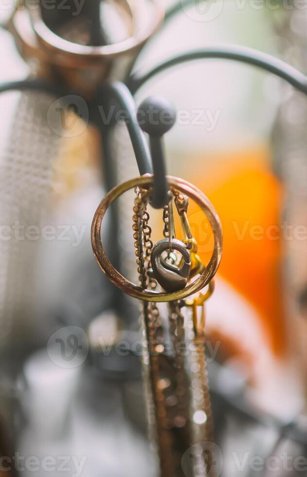 Metal stand with jewelry and bijouterie. Home storage. photo