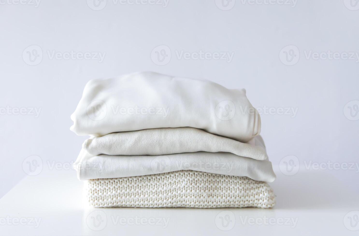Stack of folded colorful clothes. Compact storage organizing photo