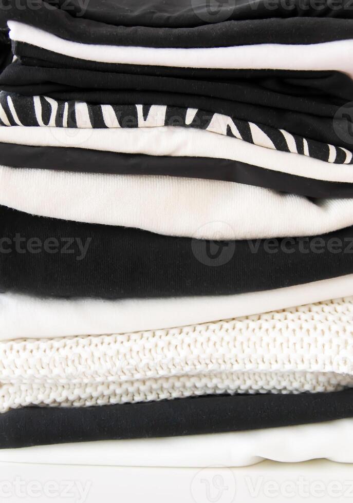 Stack of folded colorful clothes. Compact storage organizing photo