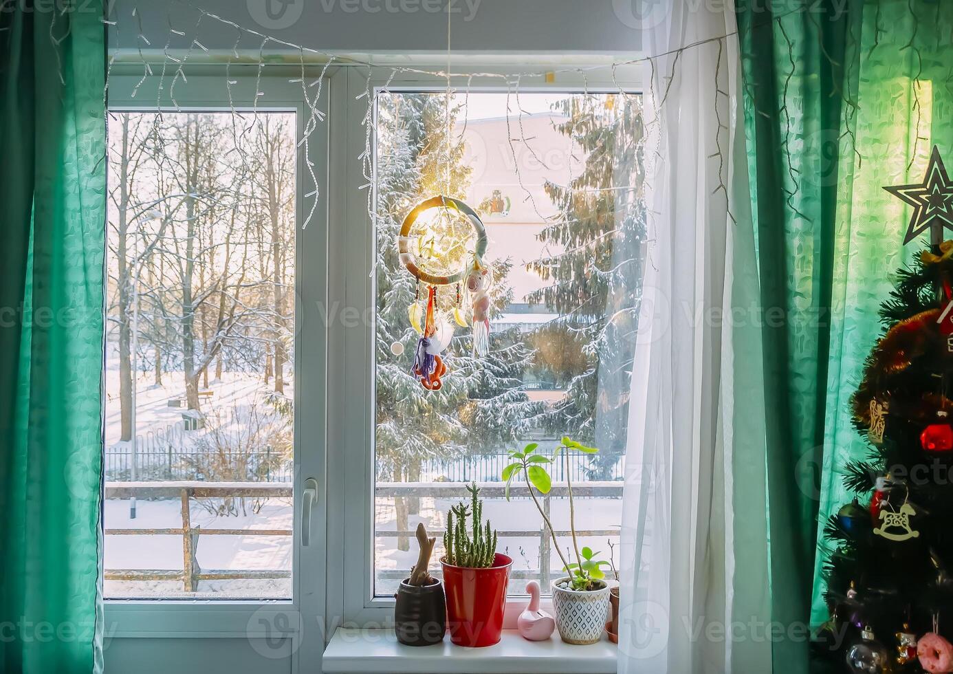 Dream catcher hanging on the window photo