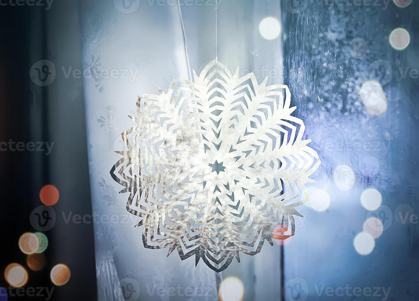 Paper snowflakes in home interior. Christmas and New year decor. photo