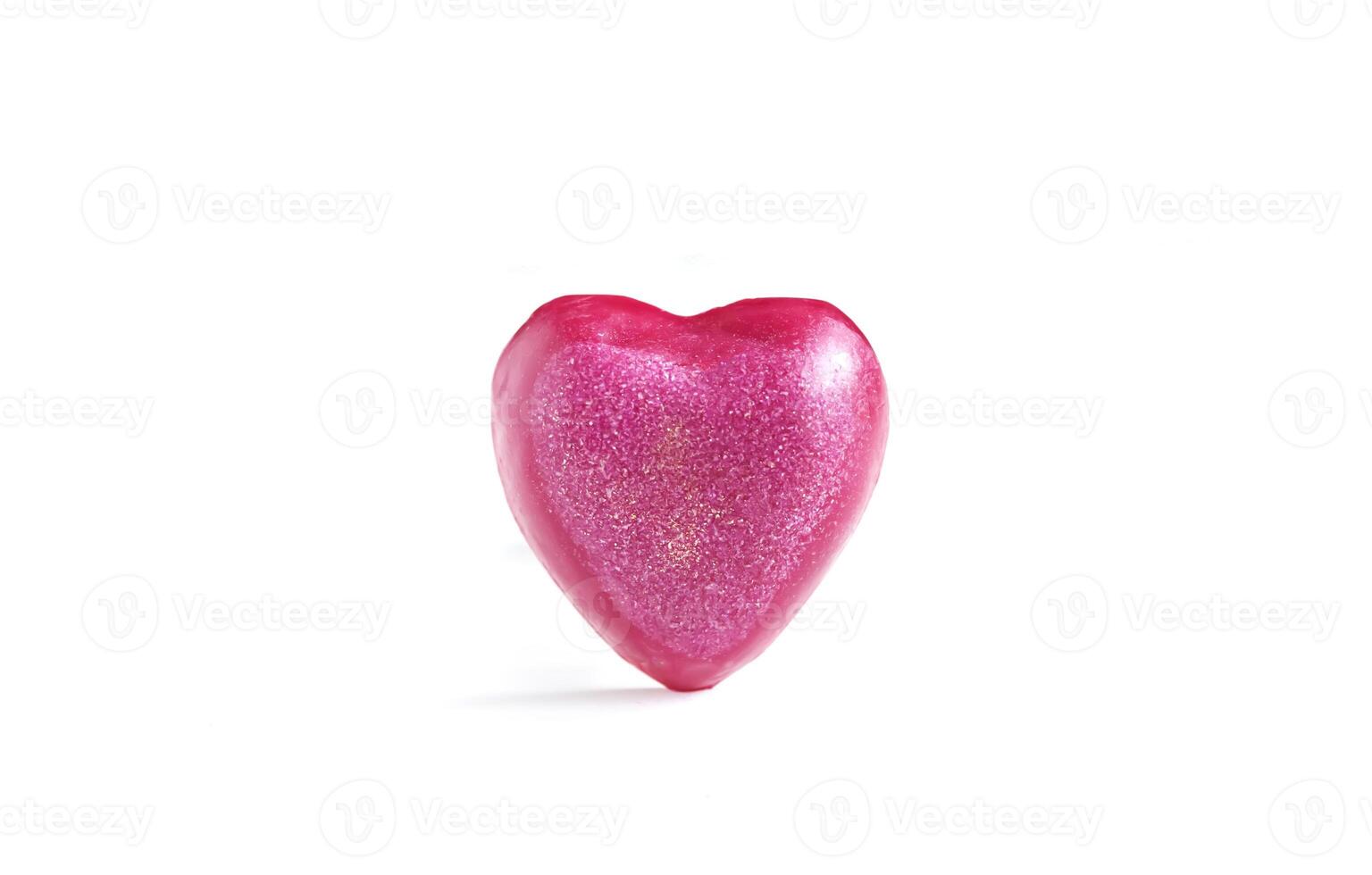 Heart shaped bar of soap on a light soft background. Top view. photo