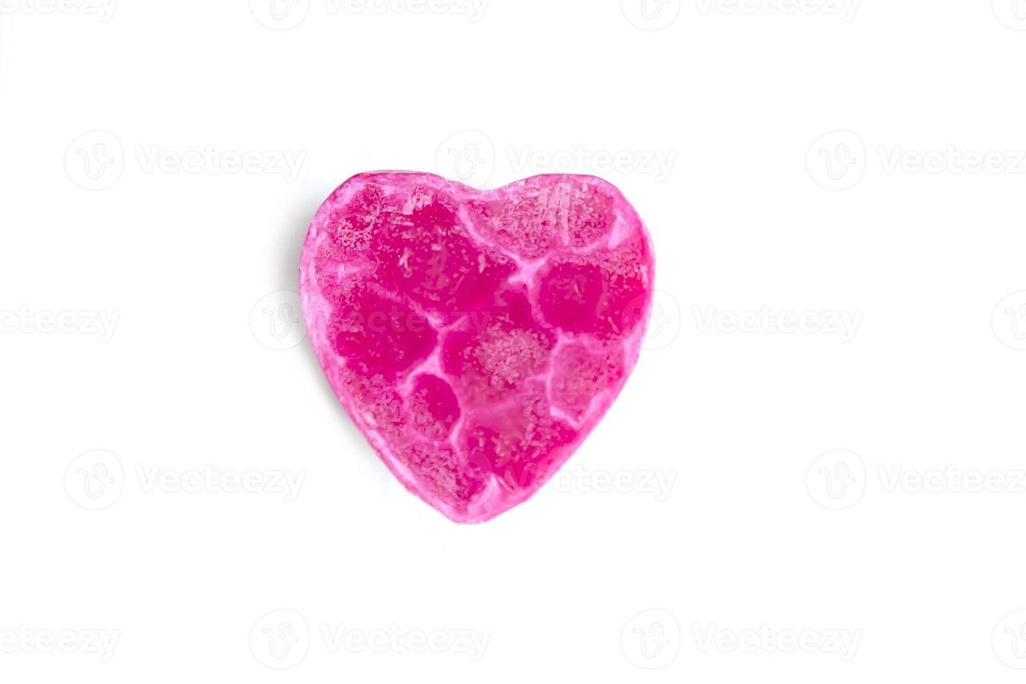 Heart shaped bar of soap on a light soft background. Top view. photo