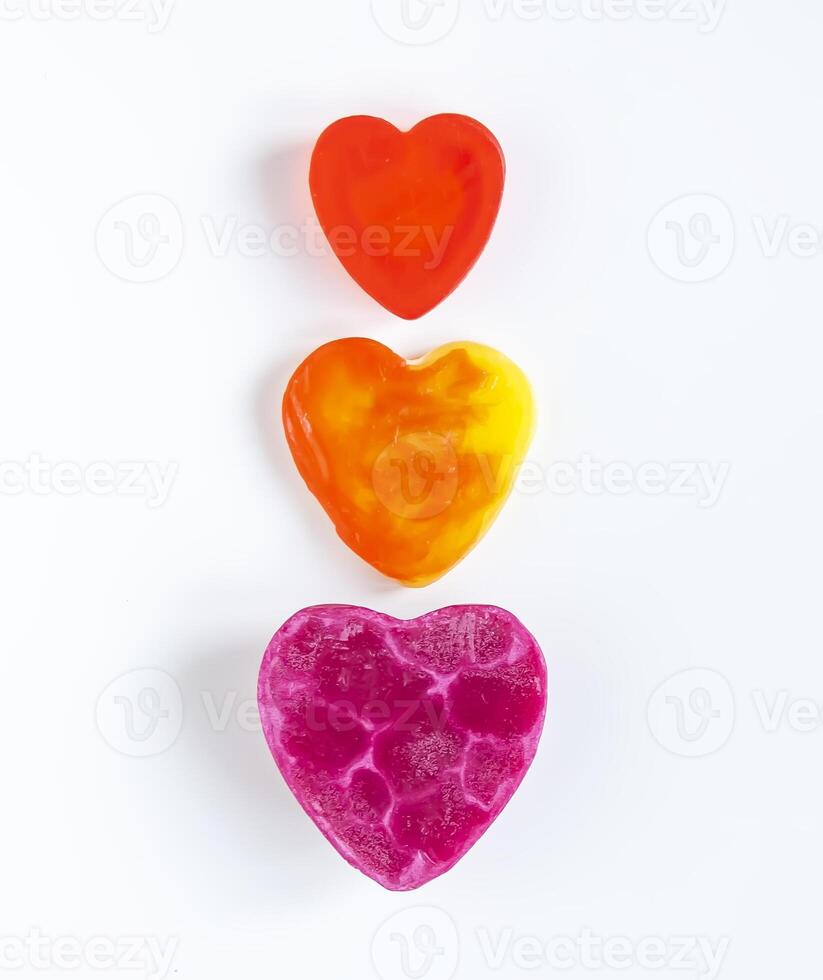 Heart shaped bars of soap on a light soft background. Top view. photo
