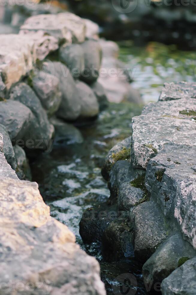 Flowing water on Bastion hill in Riga, Latvia, East Europe photo