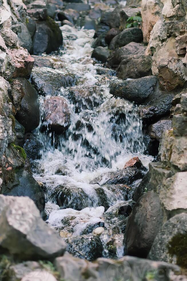 Flowing water on Bastion hill in Riga, Latvia, East Europe photo