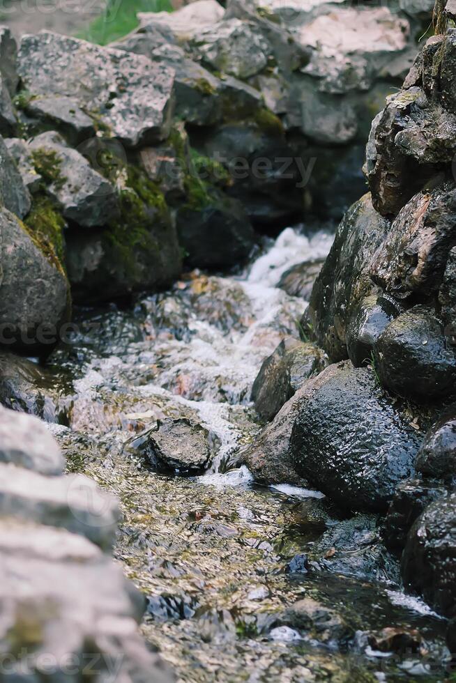 Flowing water on Bastion hill in Riga, Latvia, East Europe photo