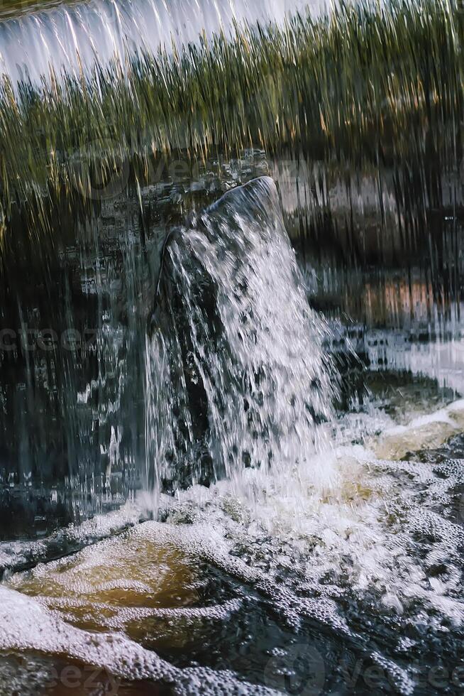 Flowing water on Bastion hill in Riga, Latvia, East Europe photo