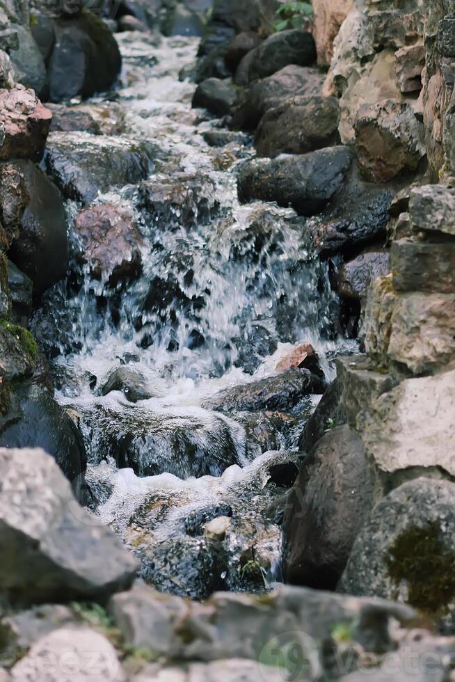 Flowing water on Bastion hill in Riga, Latvia, East Europe photo