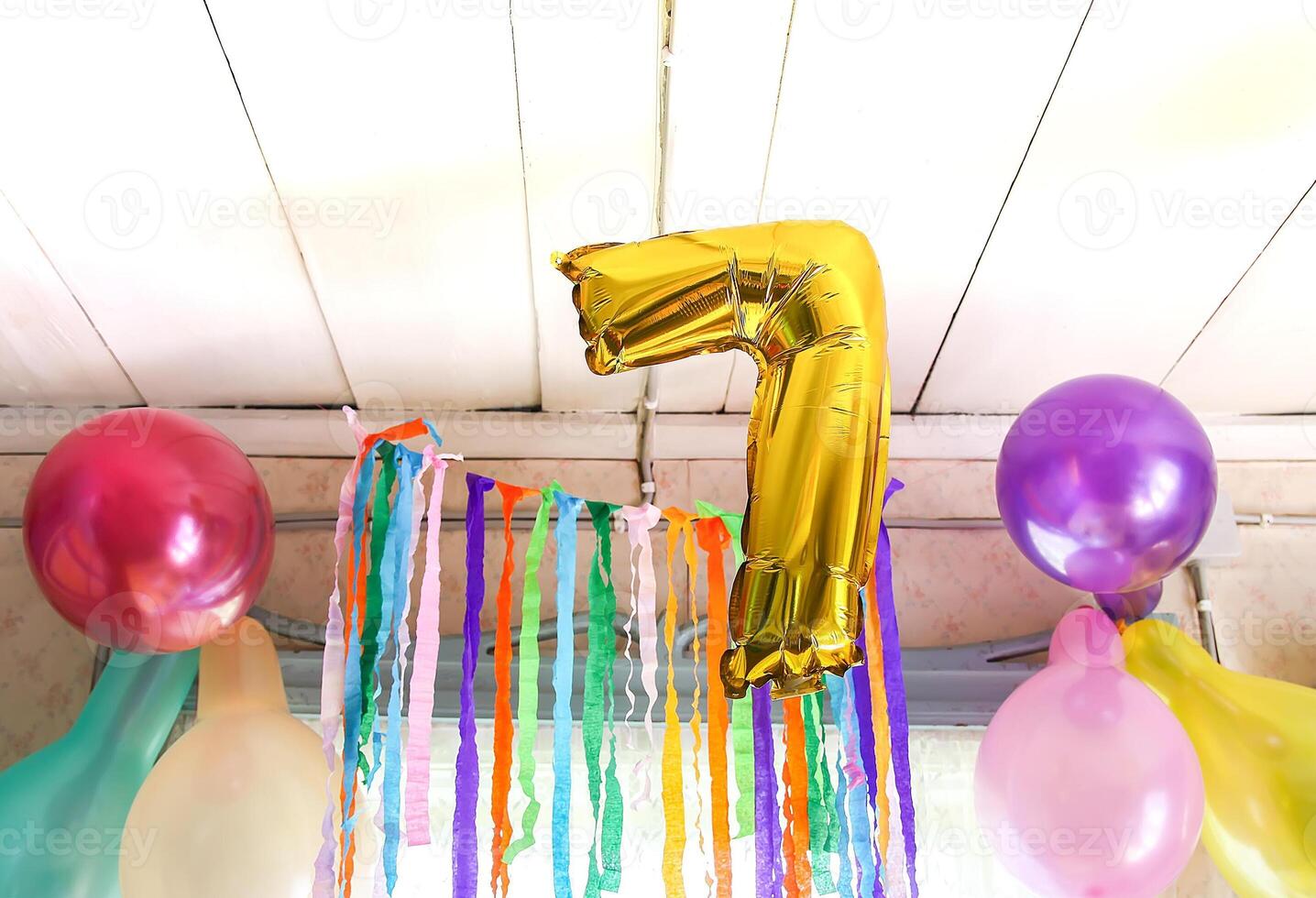 Gold balloon number 7. Child's birthdayparty decor in rural interior photo