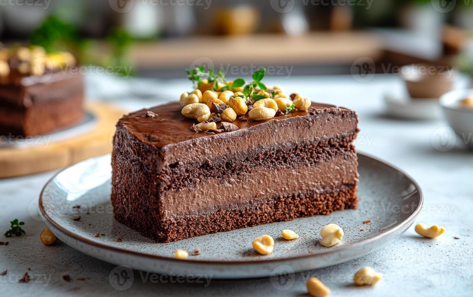 A slice of chocolate cake with nuts on top. The cake is on a white plate and is cut into a triangle photo