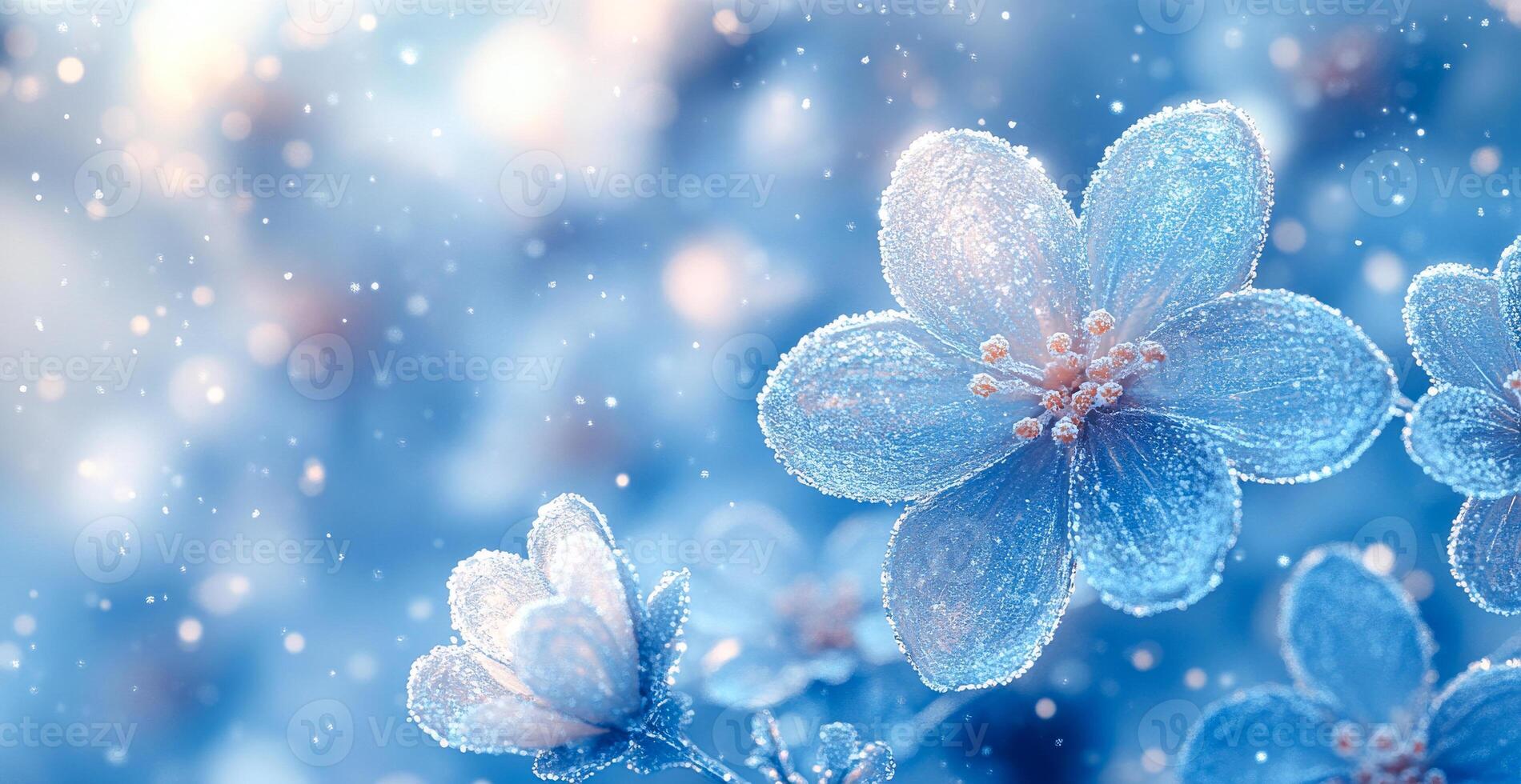A blue flower with snowflakes on it. The snowflakes are falling on the flower, giving it a wintery feel photo