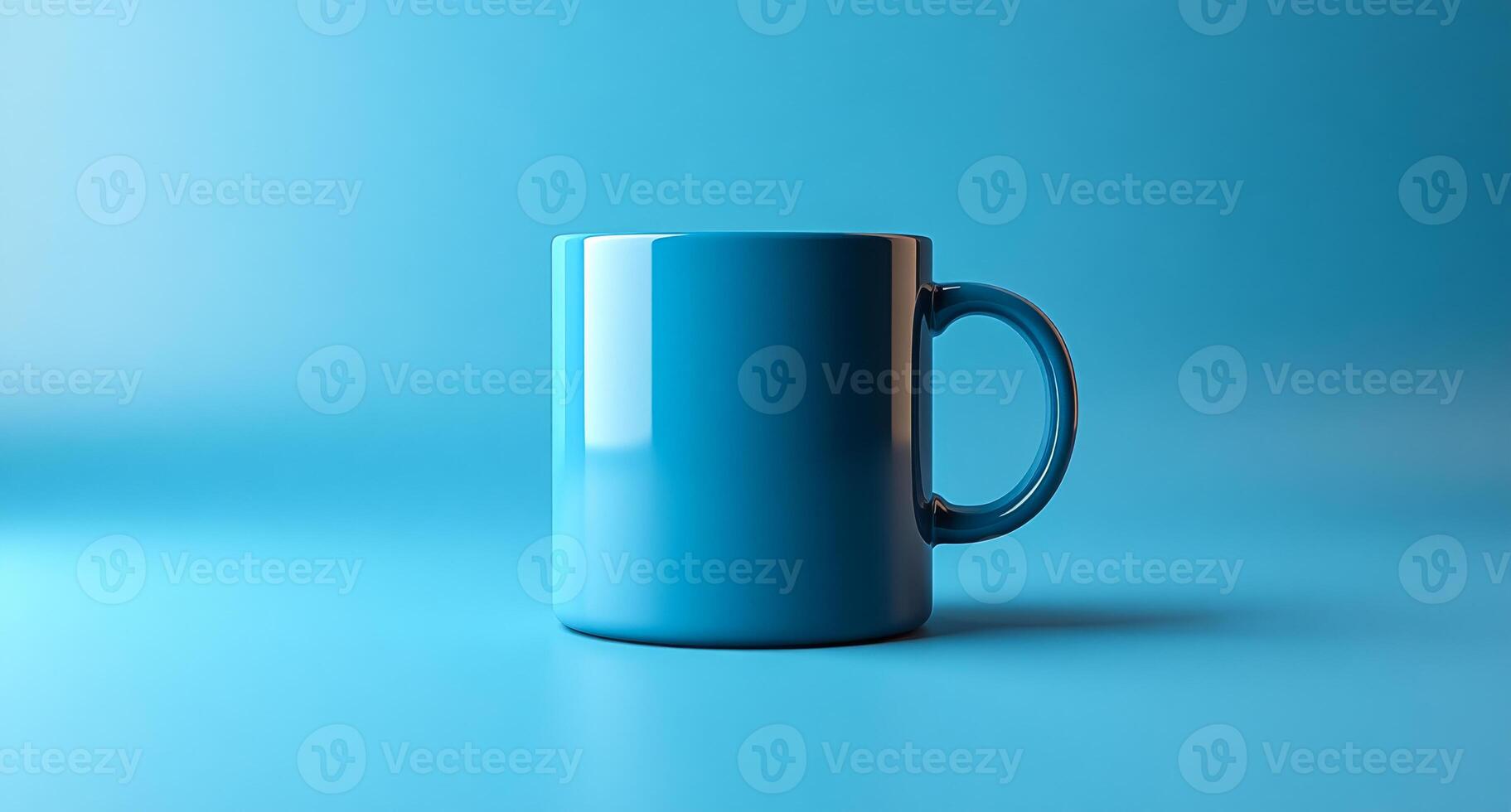 A blue coffee cup sits on a blue table photo