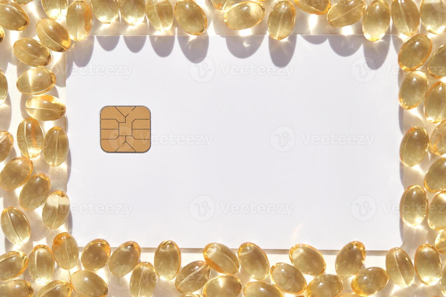 Transparent capsules frame around a sim card on white background highlighting technology and healthcare photo