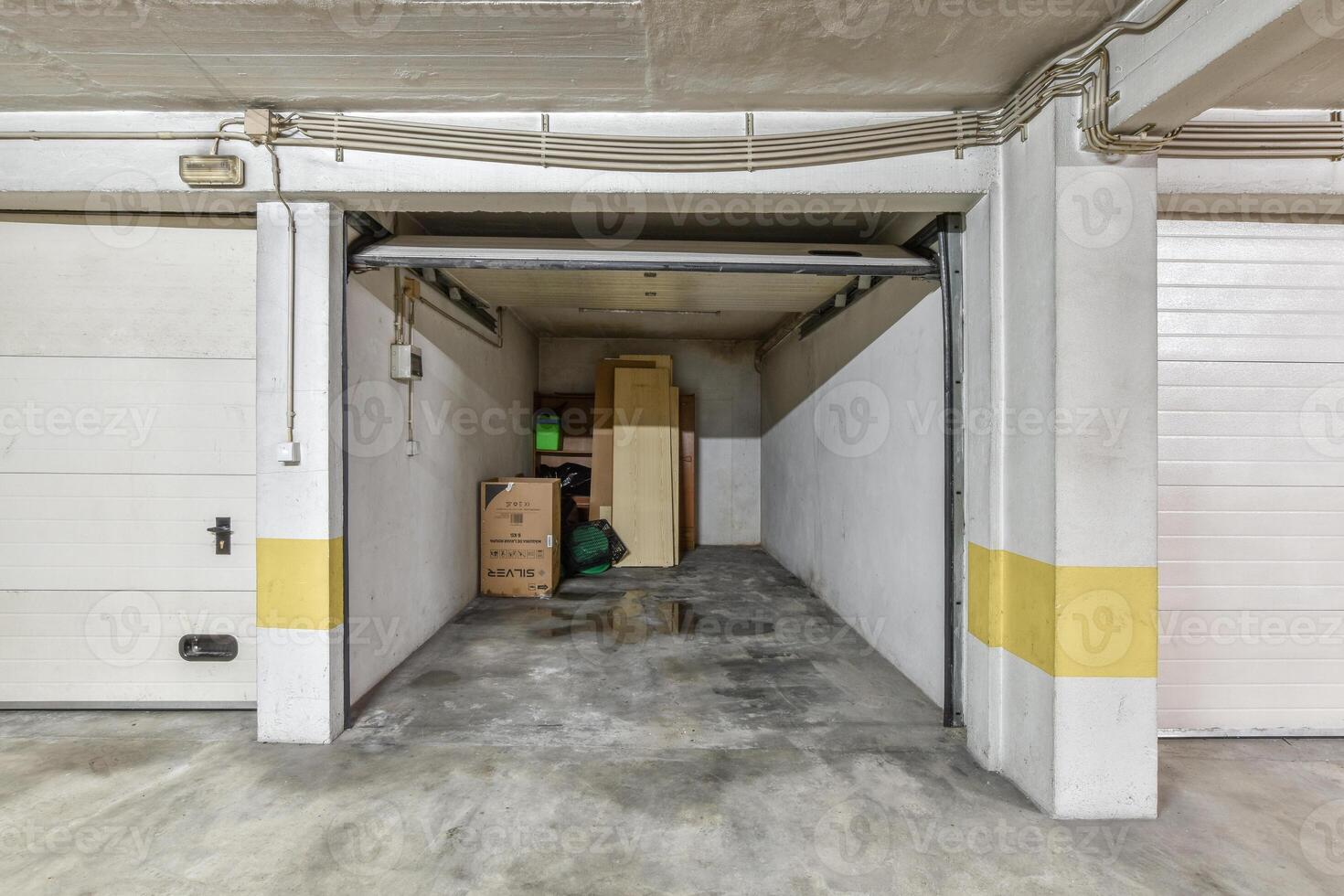 Garage with two doors and a yellow stripe photo