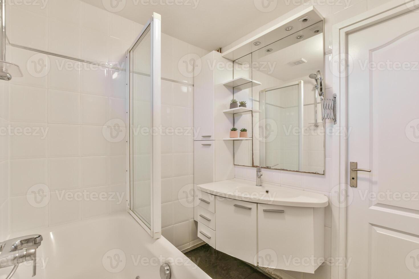 A bathroom with a sink, toilet and shower photo