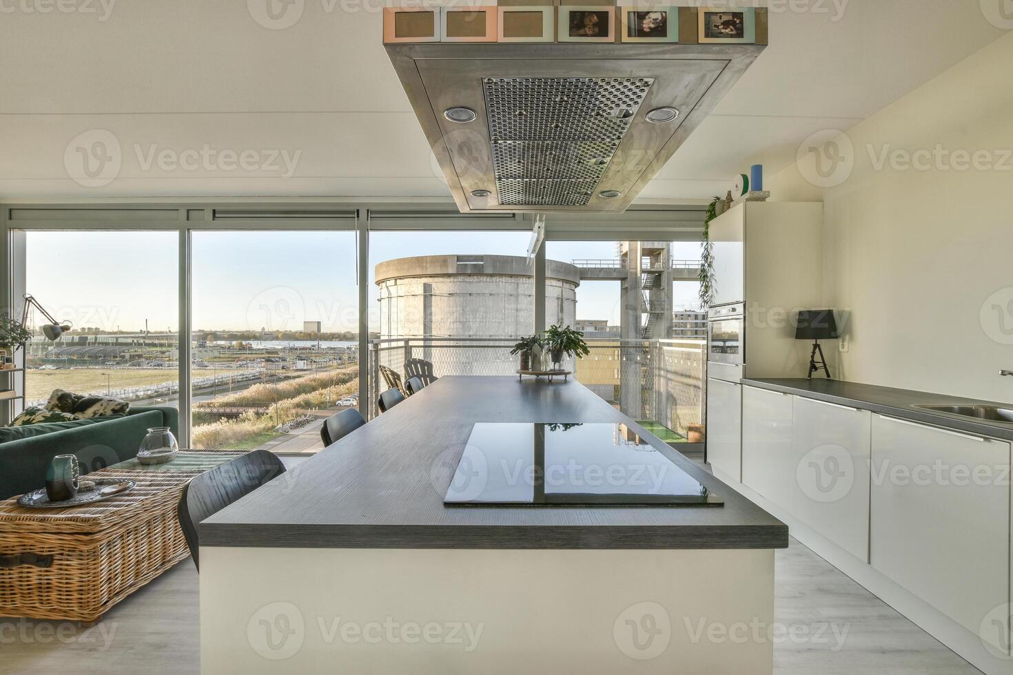 A kitchen with a view of the city photo