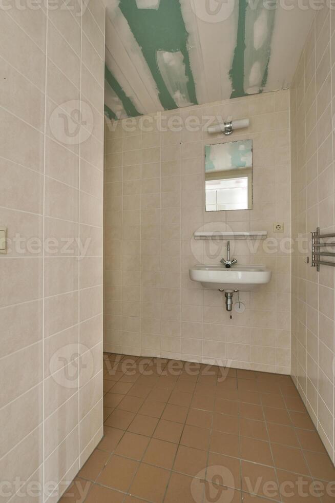 A bathroom with a sink and a mirror photo
