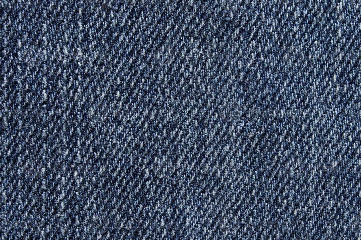 Blue jean texture. Blank denim cloth textile background. Soft fabric. Flat cotton surface. Grunge structure design. Dark navy material. Indigo vintage style. Copyspace photo