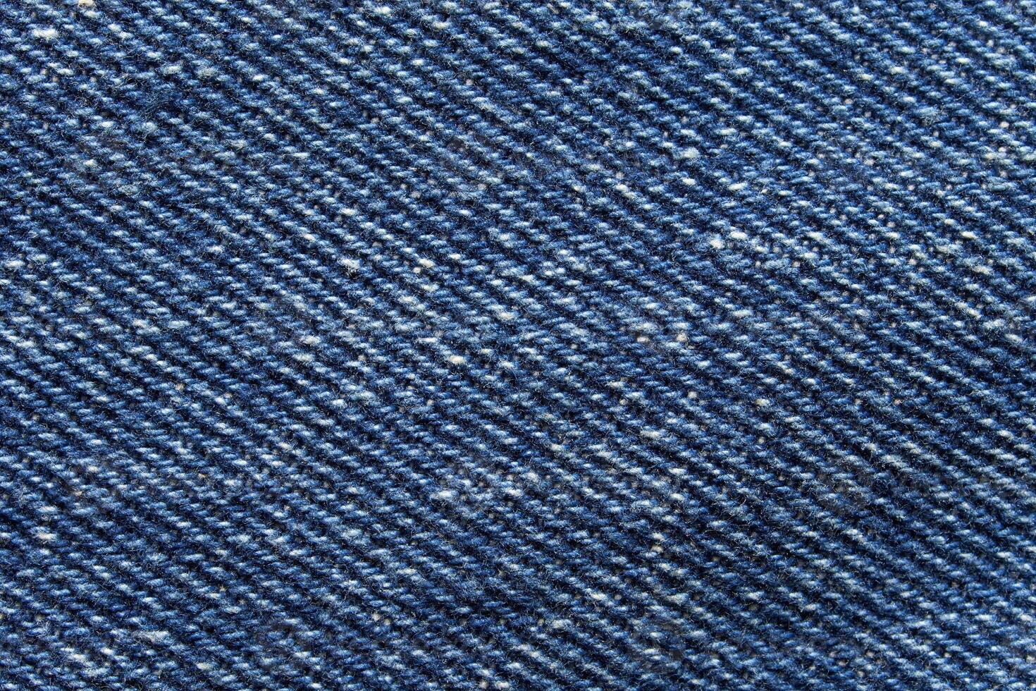 Blue jean texture. Blank denim cloth textile background. Soft fabric. Flat cotton surface. Grunge structure design. Dark navy material. Indigo vintage style. Copyspace photo