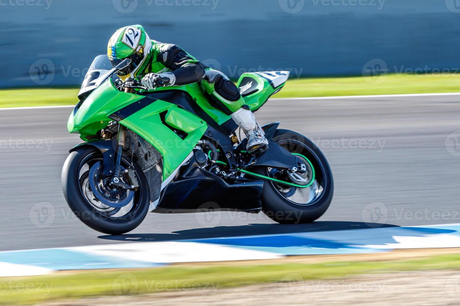 High-Speed Motorcycle Racing on a Track Circuit. All logos and trademarks have been removed. photo