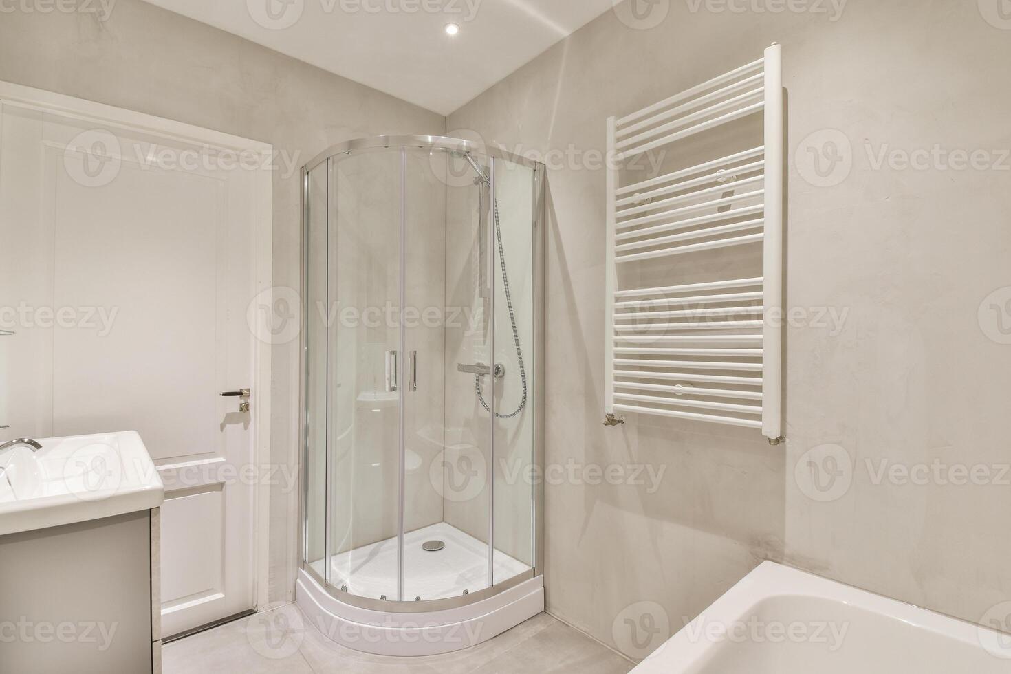 A bathroom with a shower, sink and toilet photo