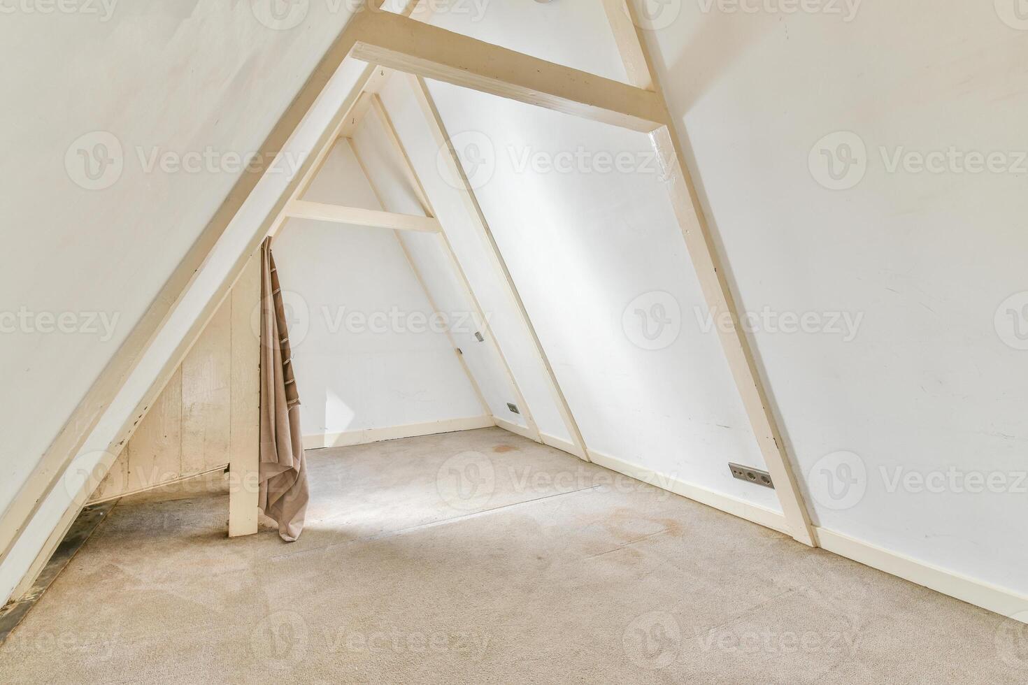 An attic with a window and a door photo