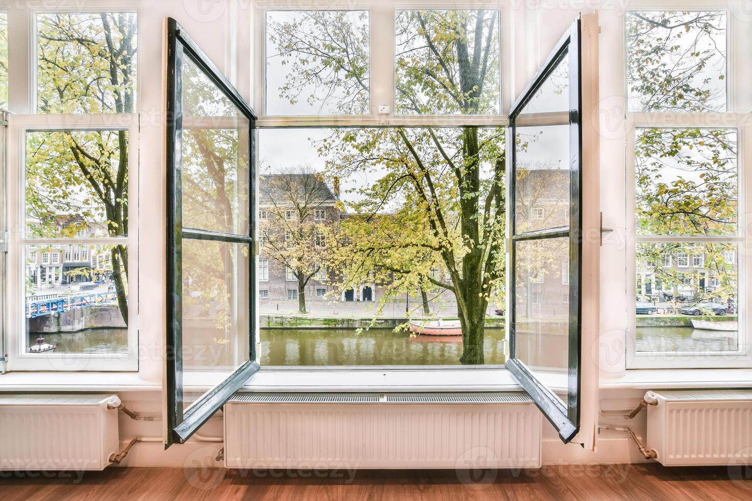 An open window with a view of a river photo