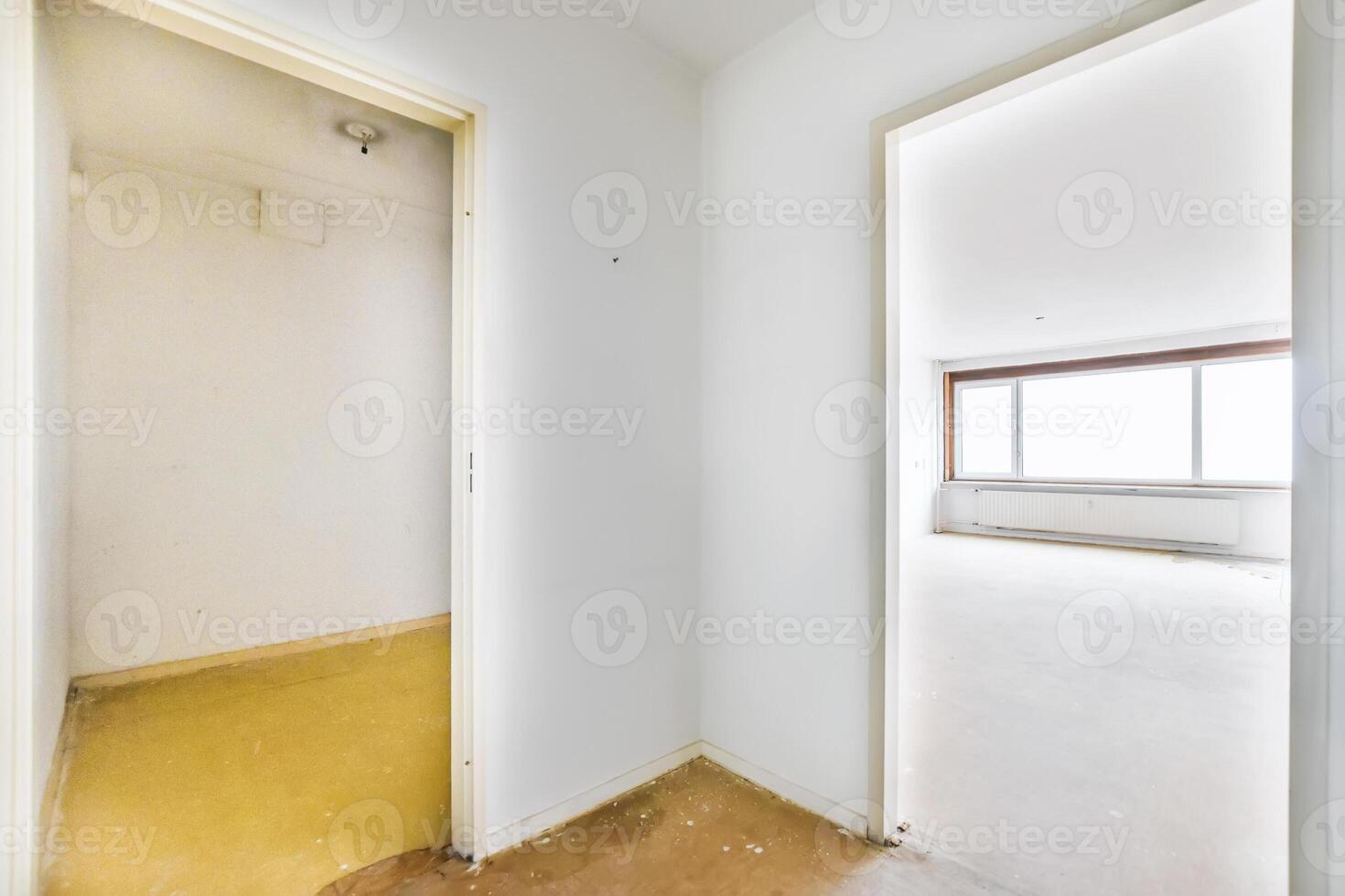 Empty room with yellow floor and open door photo