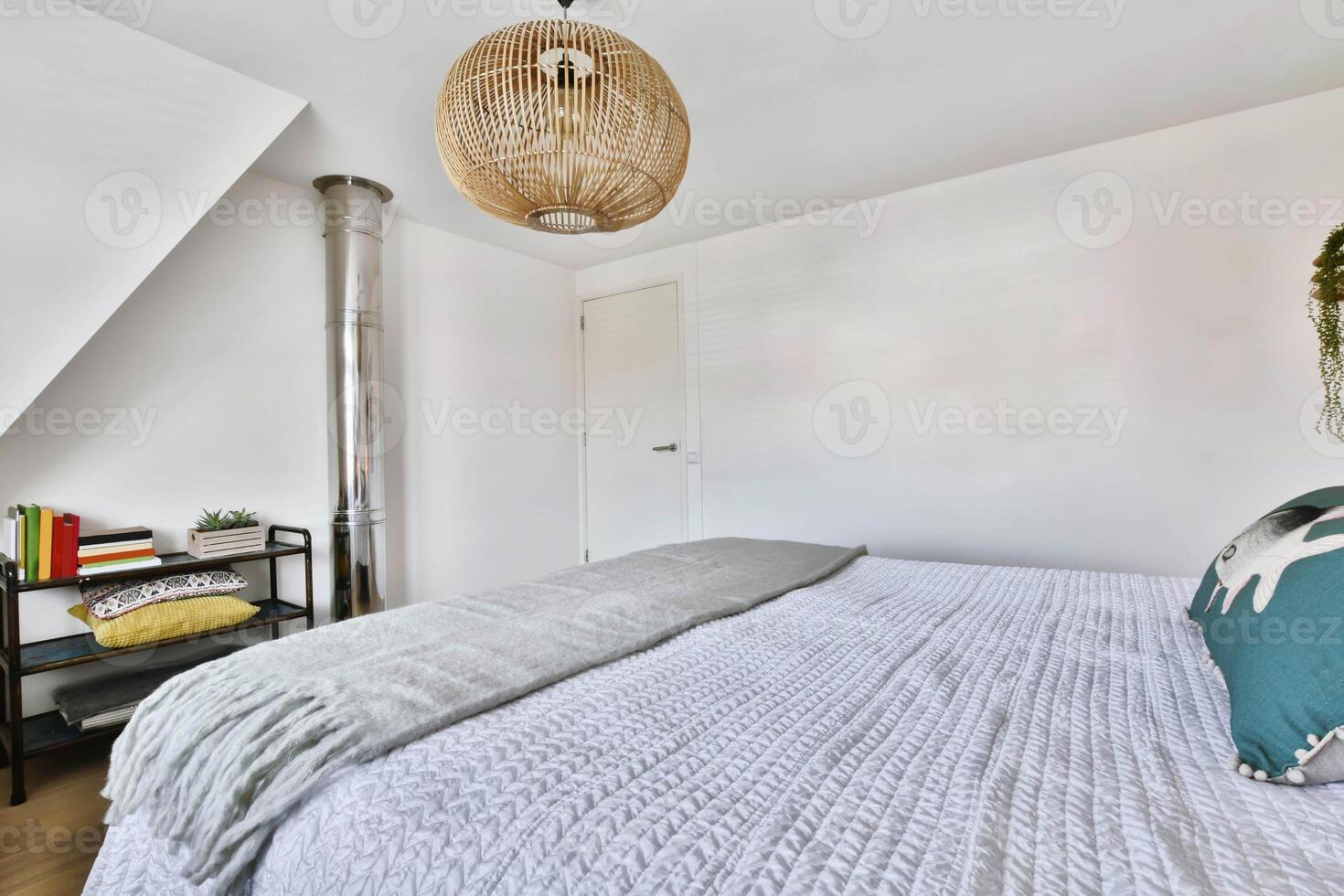 A bedroom with a bed, a lamp and a window photo