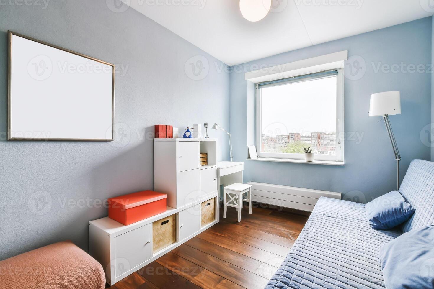 A small room with a bed, desk and window photo