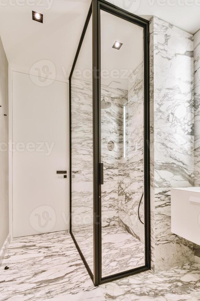 A bathroom with marble walls and flooring photo
