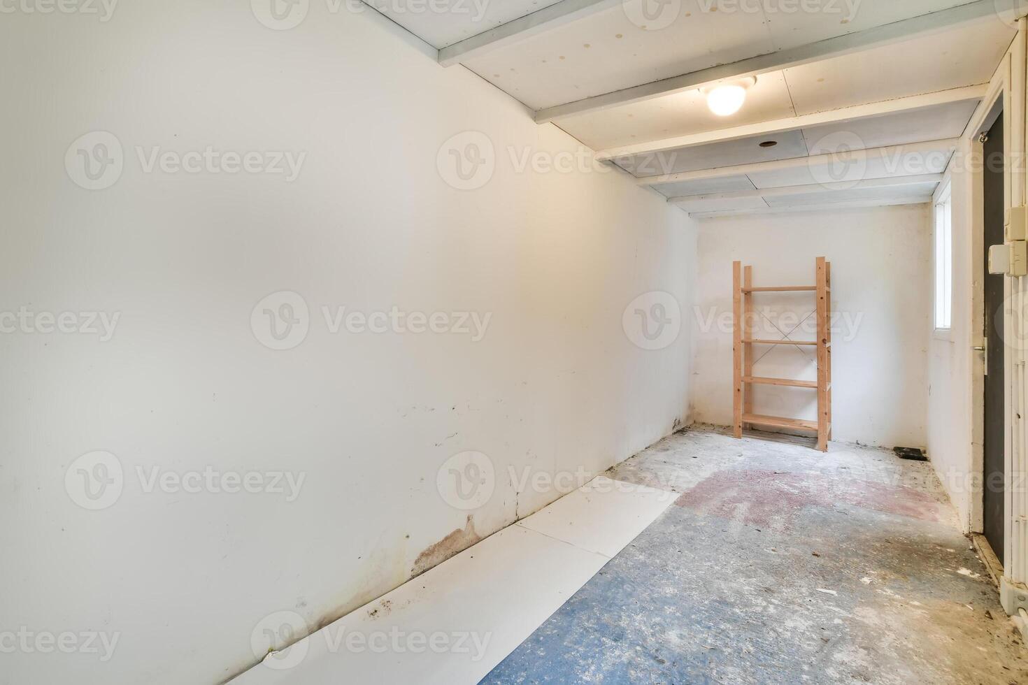A room with a ladder and a shelf in it photo