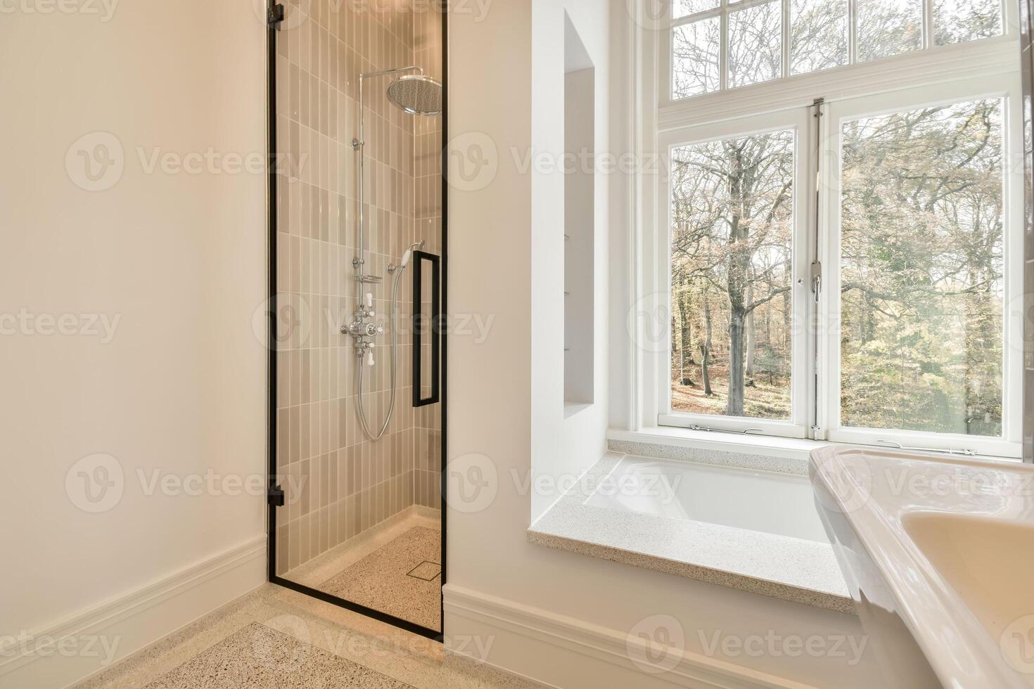 A bathroom with a shower and a tub photo