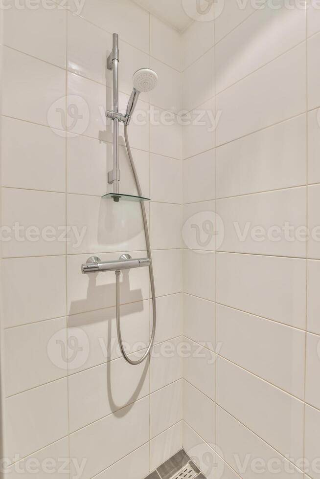 A shower with a shower head and a shower head photo