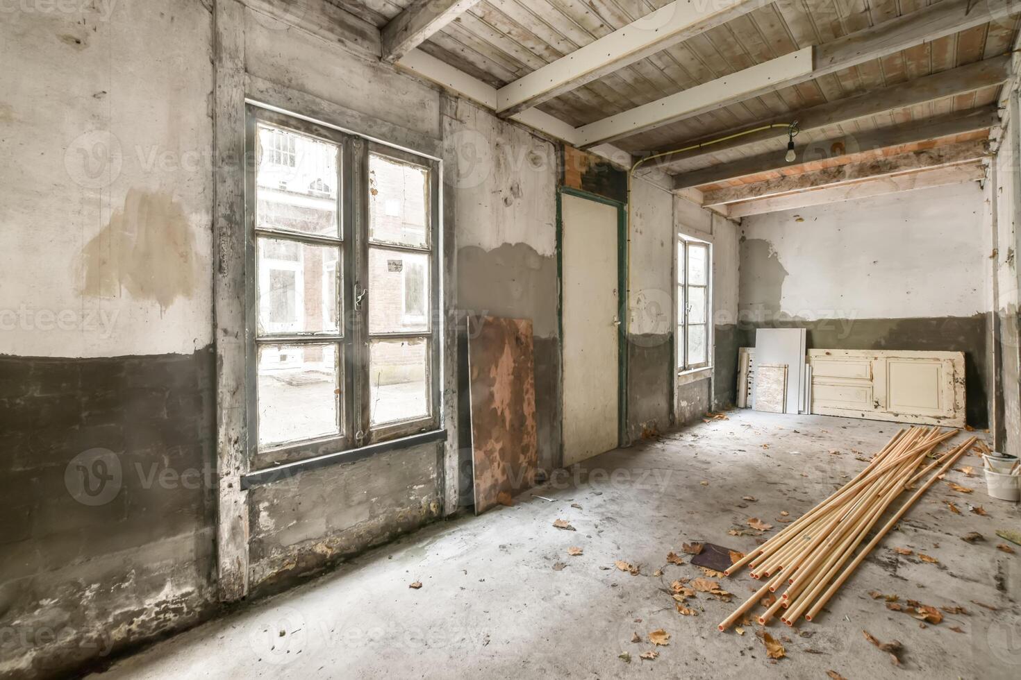 An empty room with wood and a window photo