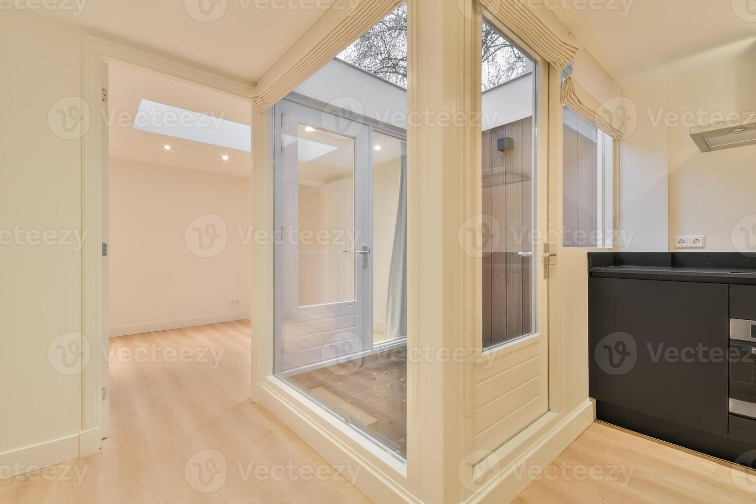 A kitchen with a sliding door and a window photo