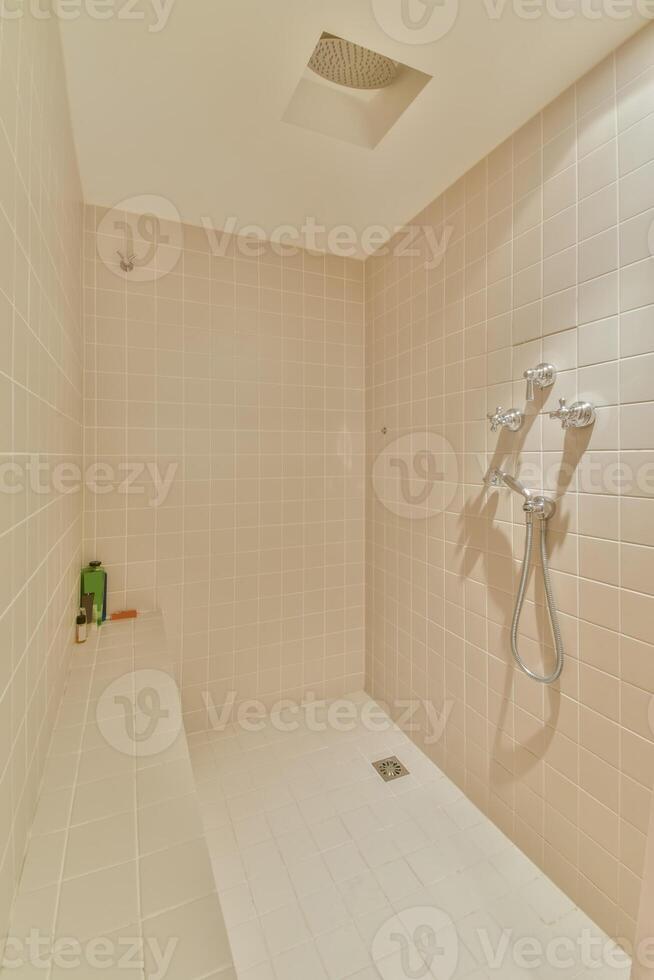A shower with a shower head and a shower head photo