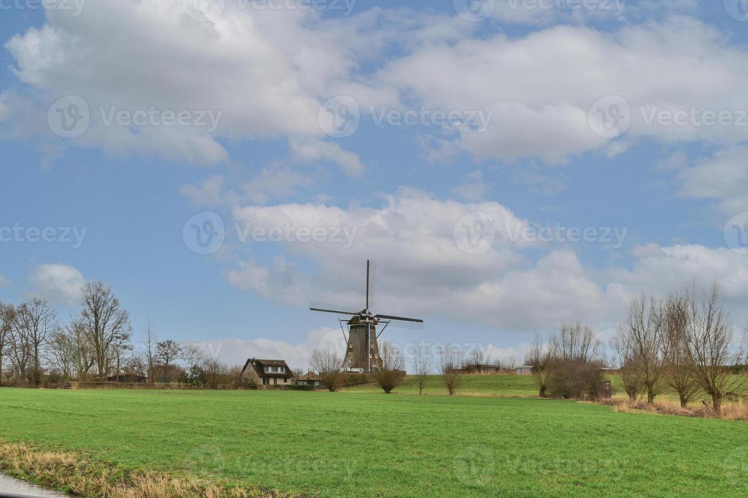 A field with a windmill photo