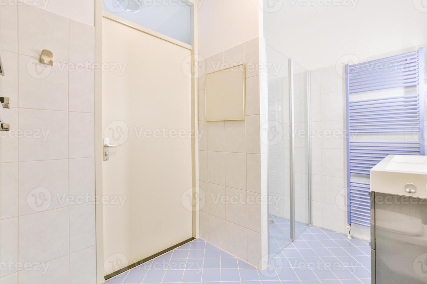 A bathroom with a shower and a sink photo