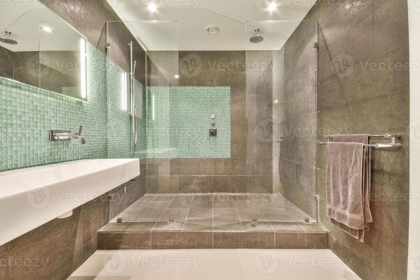 A modern bathroom with a glass shower stall photo