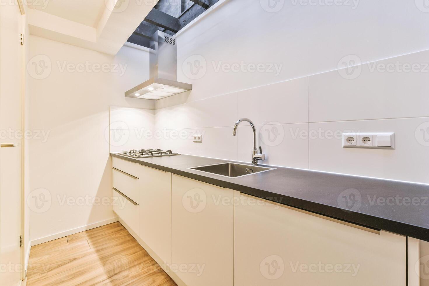 A kitchen with a sink and a window photo