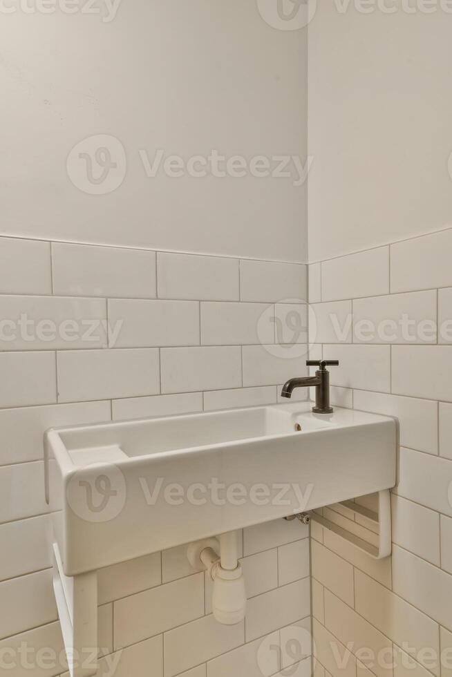 A bathroom with a sink and a toilet in it photo