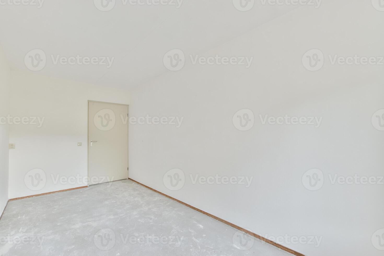 Empty room with white walls and a door photo