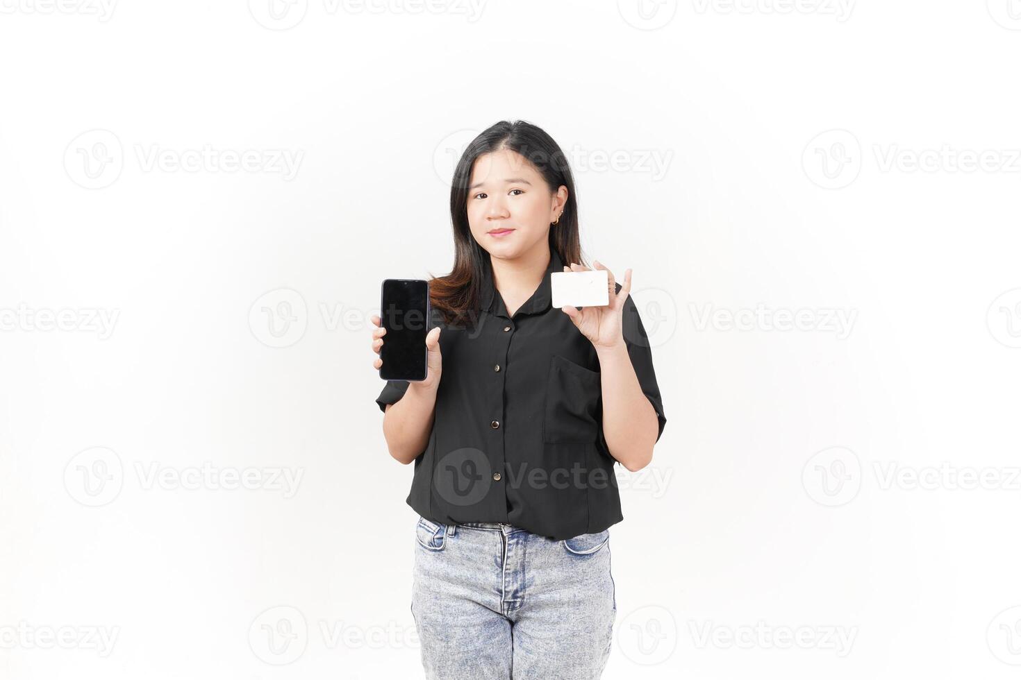Online shopping concept. asian woman holding credit card and smartphone app, buying, order delivery in mobile phone application, standing over white background photo