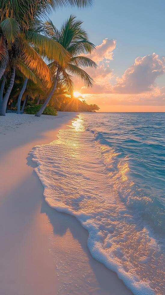 A clean white sandy beach stretches under a vast blue sky, with clear turquoise waters sparkling in the warm sunlight. Soft, foamy waves gently lap the shore perfect for eco-tourism posters or media. photo